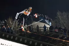 BISCHOFSHOFEN, Avstrija &ndash; Smučarski skakalec Domen Prevc (SLO) med poletom na tekmi novoletne turneje v Bischofshofnu. / Foto: Peter Ko&scaron;enina